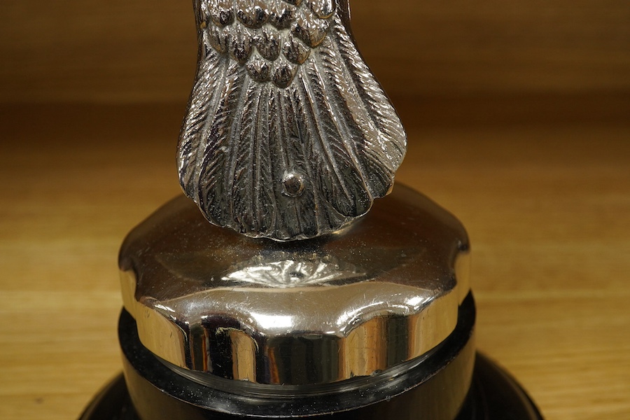 A large chromed eagle car mascot, mounted on a large radiator cap and turned socle, height 21.5cm. Condition - good.